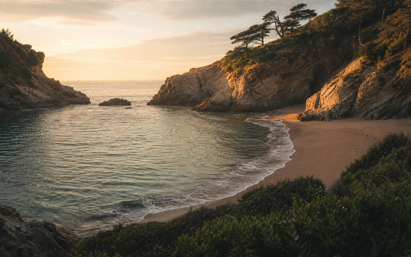 Warm sunrise light reaching into a sheltered coastal cove